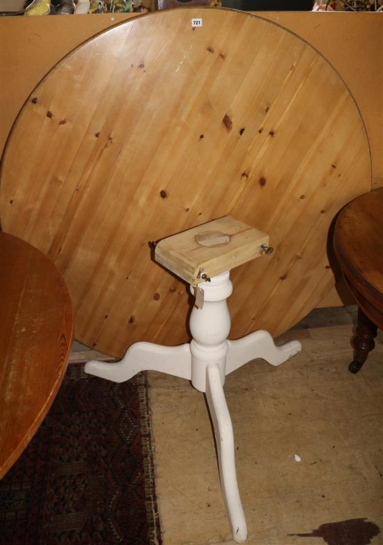 A large circular topped pine table, diameter 4ft 6in.